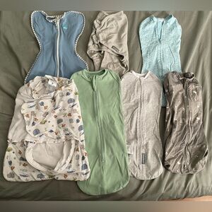 Seven newborn swaddles - multiple brands including Halo and Happiest Baby